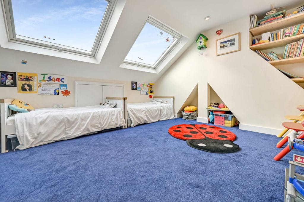 Spacious children’s bedroom loft conversion idea, with space in the loft to sleep, play and explore.